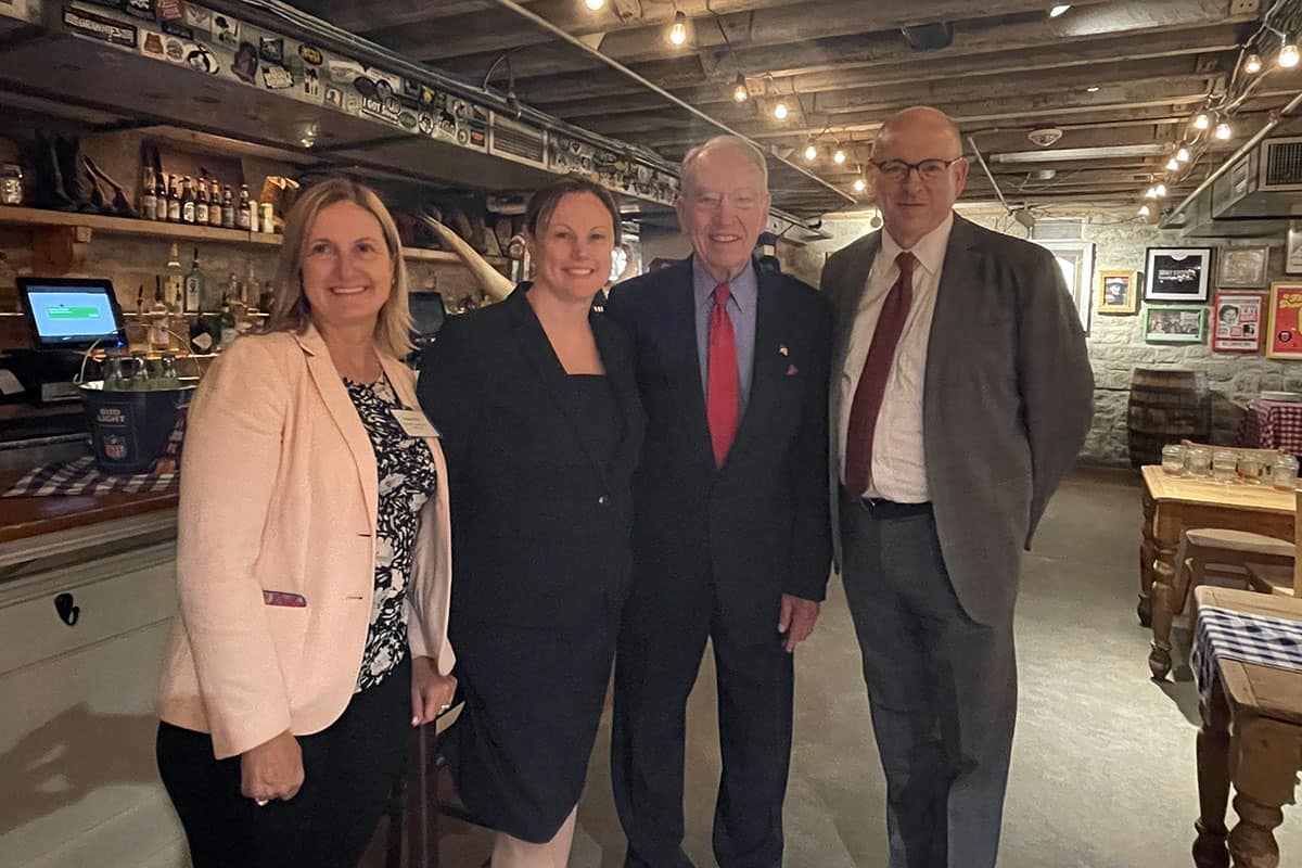 Academy Senior Director of Government Relations, Susan Pilch, JD, Academy President, Virginia Ramachandran, AuD, PhD, Senator Chuck Grassley; and Academy Executive Director Patrick Gallagher, MBA